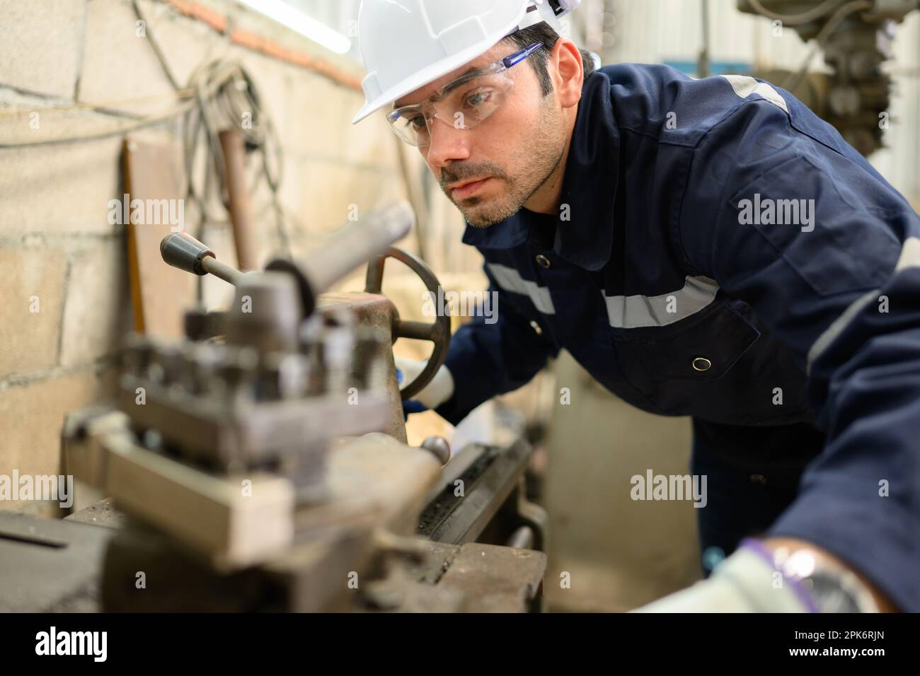 Engineer technician controlling robotic arms on computer laptop Stock Photo