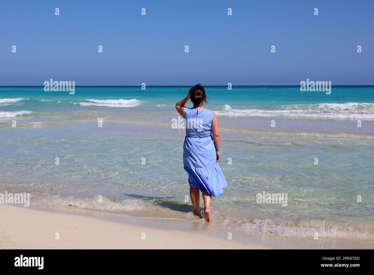 Woman barefoot on beach hi-res stock photography and images - Alamy