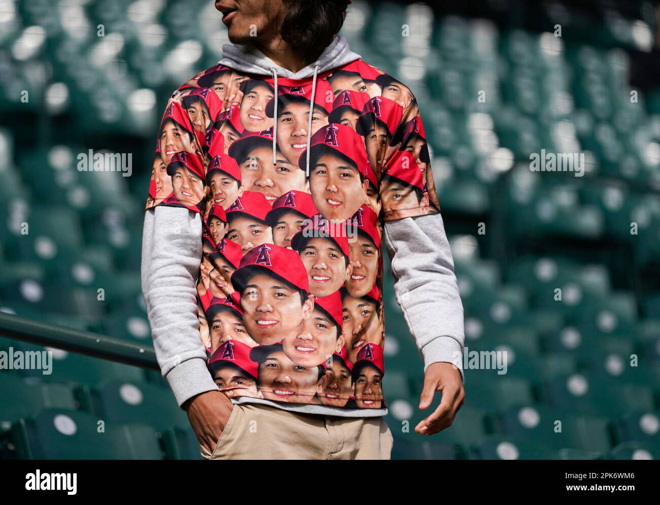 A fan wears a shirt with the face of Los Angeles Angels' Shohei