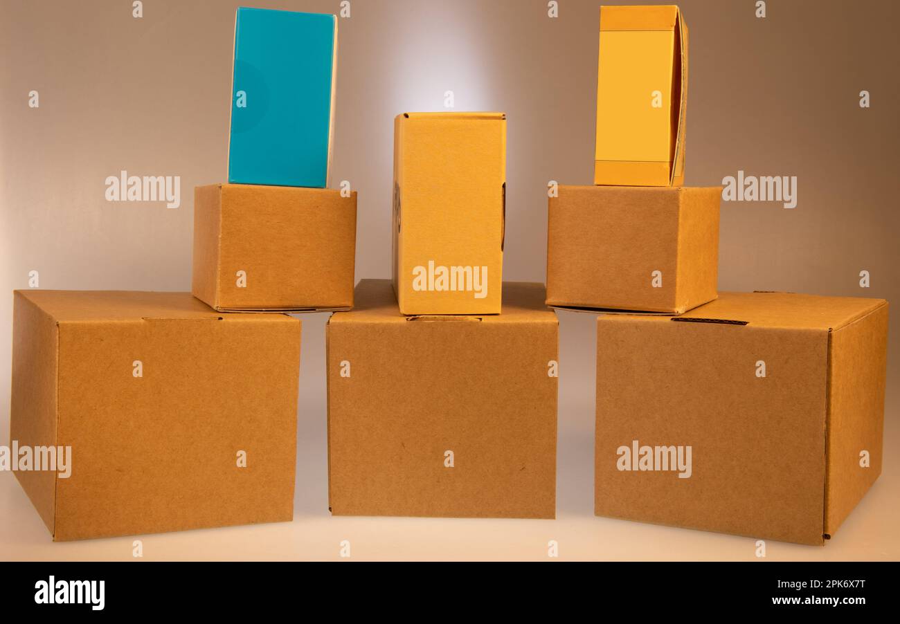Little brown boxes in various formations on my light table Stock Photo