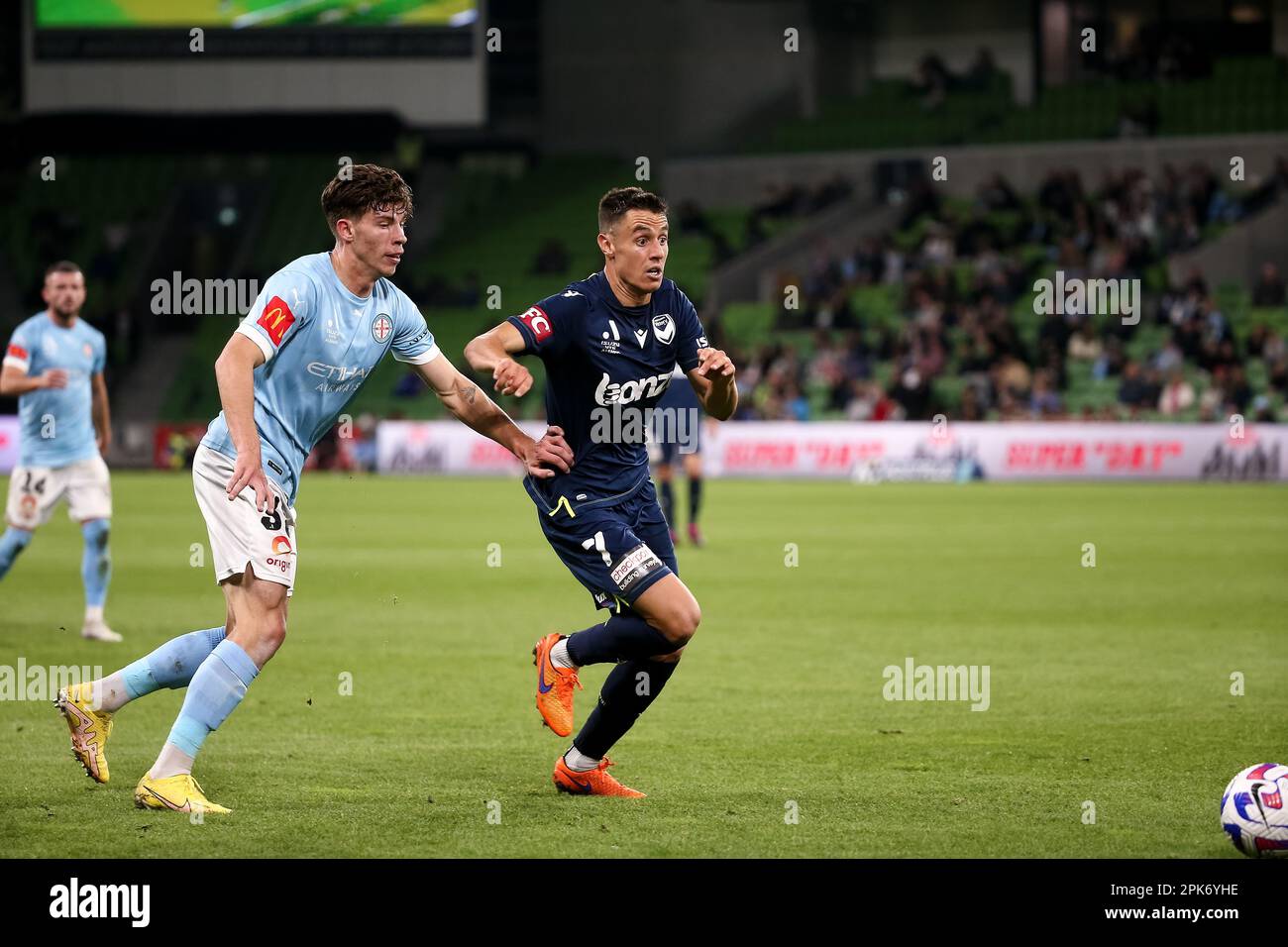 Melbourne, Australia, 5 April, 2023. Christopher Ikonomidis of Melbourne Victory controls the ball ahead of Jordan Bos of Melbourne City FC during the A-League soccer match between Melbourne City FC and Melbourne Victory at AAMI Park on April 5, 2023 in Melbourne, Australia. Credit: Dave Hewison/Speed Media/Alamy Live News Stock Photo