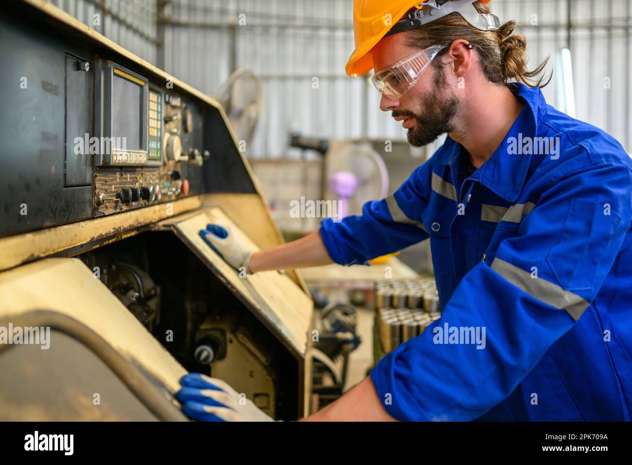 Engineer technician controlling robotic arms on computer laptop Stock Photo