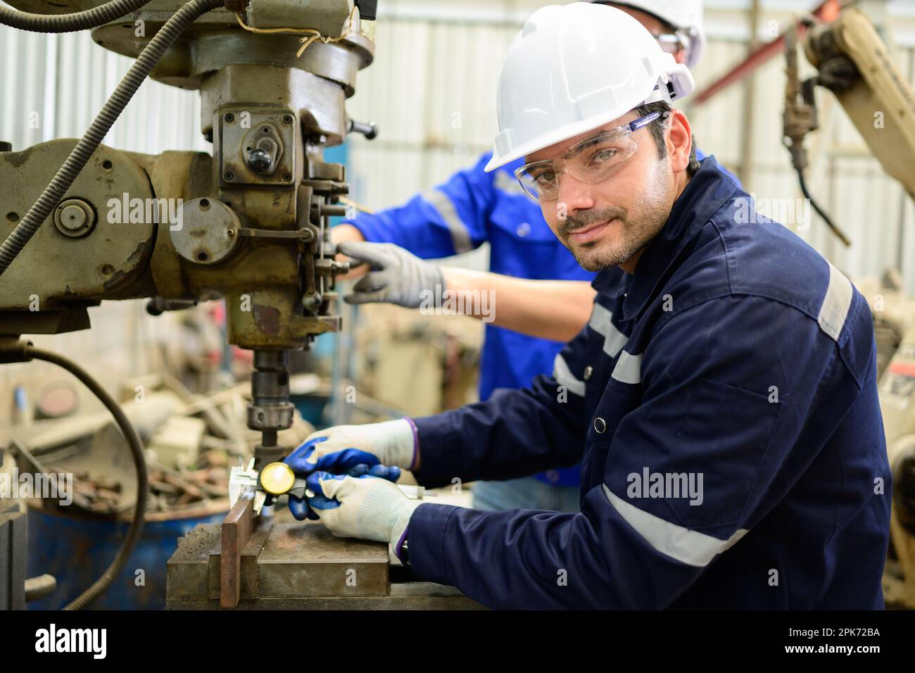 Engineer technician controlling robotic arms on computer laptop Stock Photo