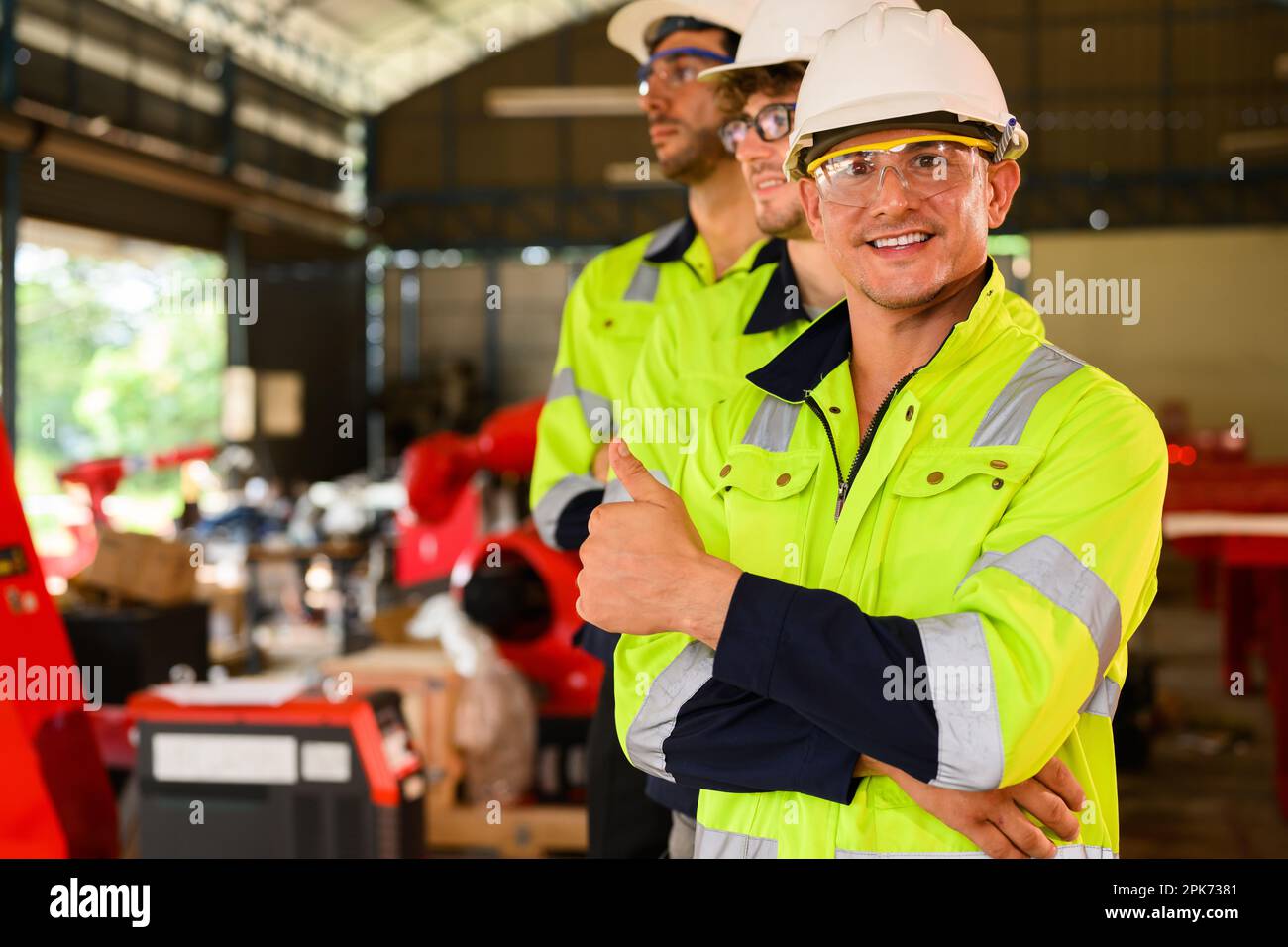 Group of technicians engineers workers posing to camera with smile Stock Photo