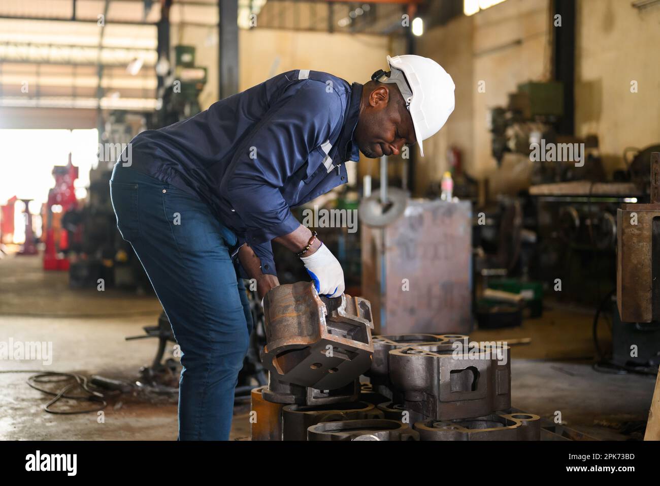 Engineer Reparing Machine Professional male technician engineer checking and repairing machine ...