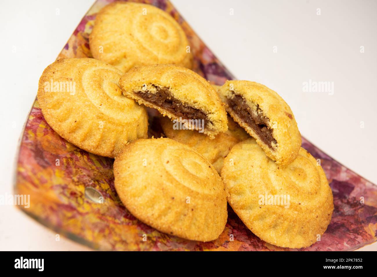 Traditional eid maamoul or mamoul cookies with dates, nuts, and jam