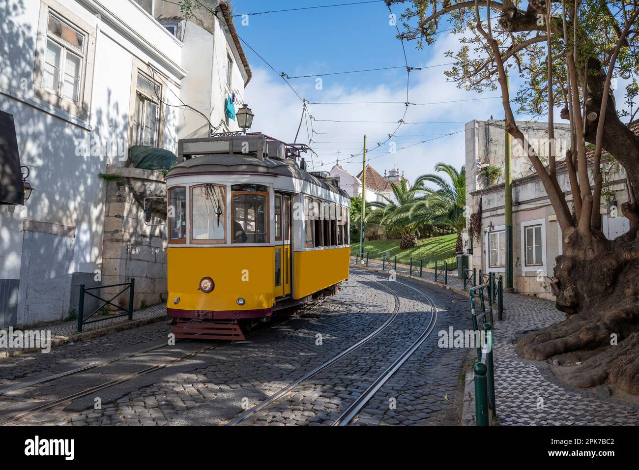 Retro yellow tram on street in Lisbon, Portugal Stock Photo