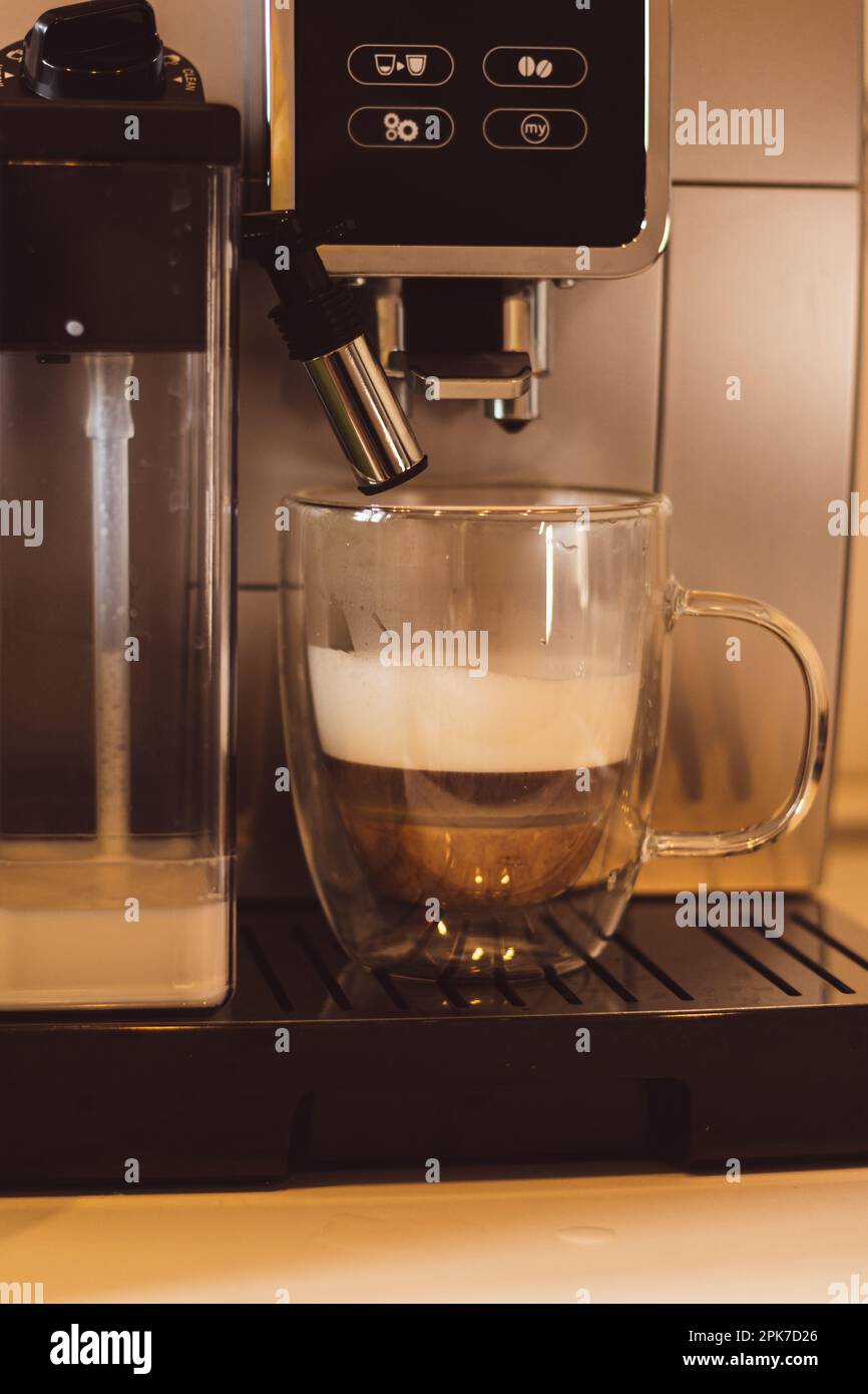 https://c8.alamy.com/comp/2PK7D26/coffee-machine-in-a-cafe-pouring-coffee-drink-cappuccino-maker-morning-drinks-latte-preparation-hot-drinks-glass-of-espresso-with-milk-2PK7D26.jpg