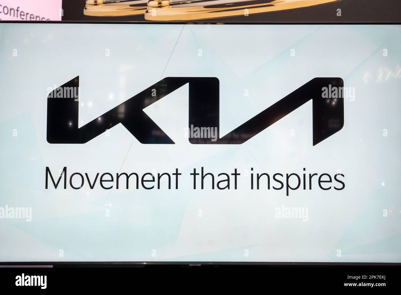 NEW YORK, NEW YORK - APRIL 05: Kia Logo seen on sign at the International Auto Show press preview at the Jacob Javits Convention Center on April 5, 2023 in New York City. Stock Photo