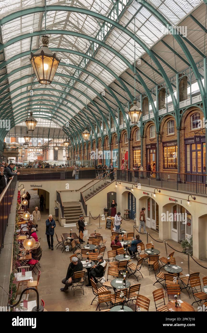 Covent Garden is a shopping and entertainment hub in London's West End. The elegant Piazza is home to fashion stores, craft stalls at the Apple Market Stock Photo