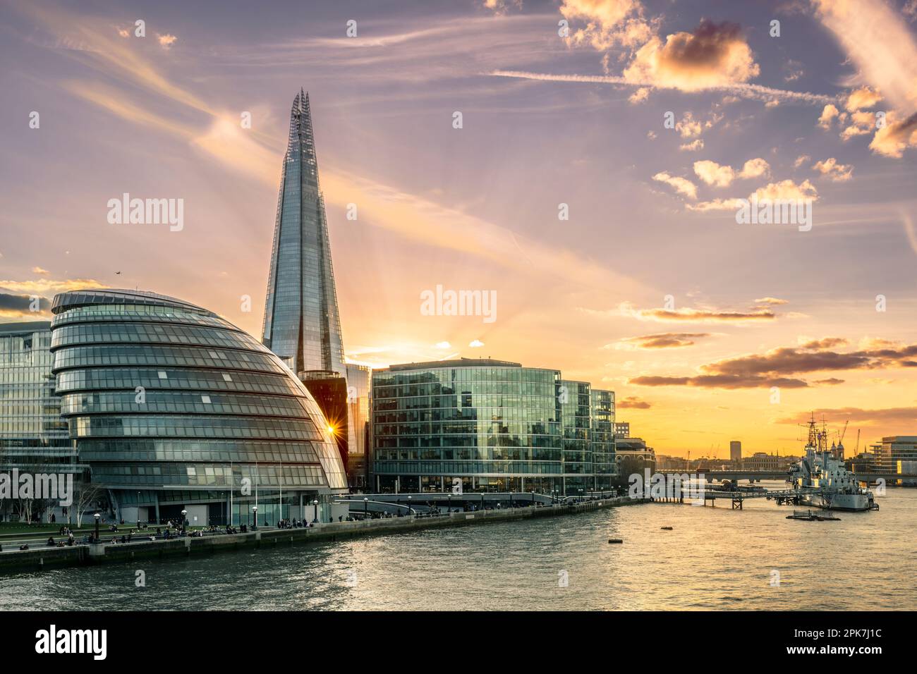 The River Thames and 'The Queens Walk' from Tower  Bridge, looking towards HMS Belfast showing some of the iconic buildings on the London skyline. Stock Photo