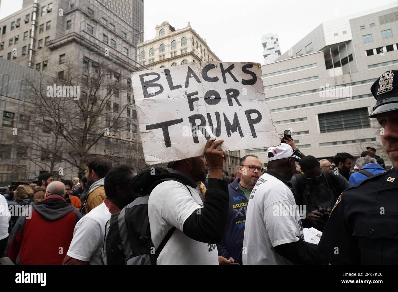 New York, USA. 3rd Apr, 2023. A Pro-Trump supporter holds a placard reading ''Blacks for Trump'' during a demonstration outside Trump Tower in support of Donald Trump prior to Trump's indictment by the Manhattan D.A. (Credit Image: © Catherine Nance/SOPA Images via ZUMA Press Wire) EDITORIAL USAGE ONLY! Not for Commercial USAGE! Stock Photo