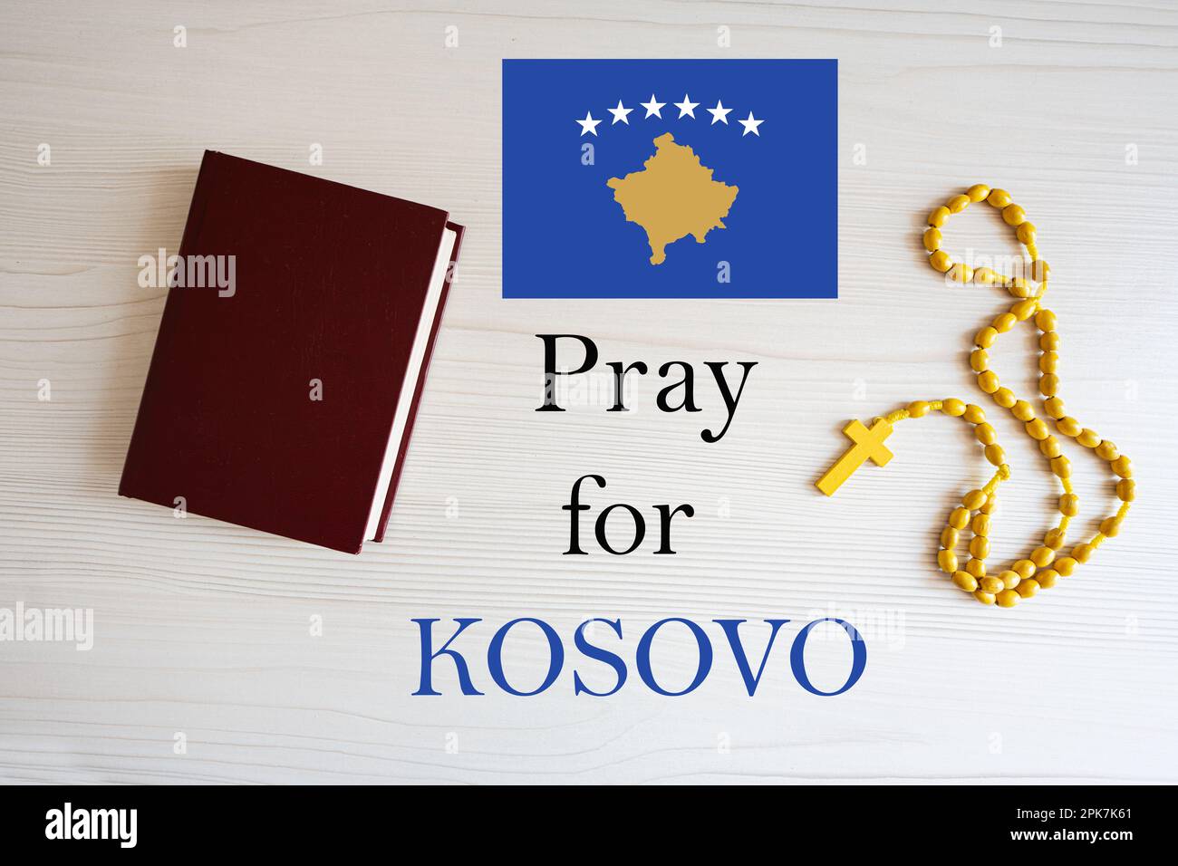 Pray for Kosovo. Rosary and Holy Bible background. Stock Photo