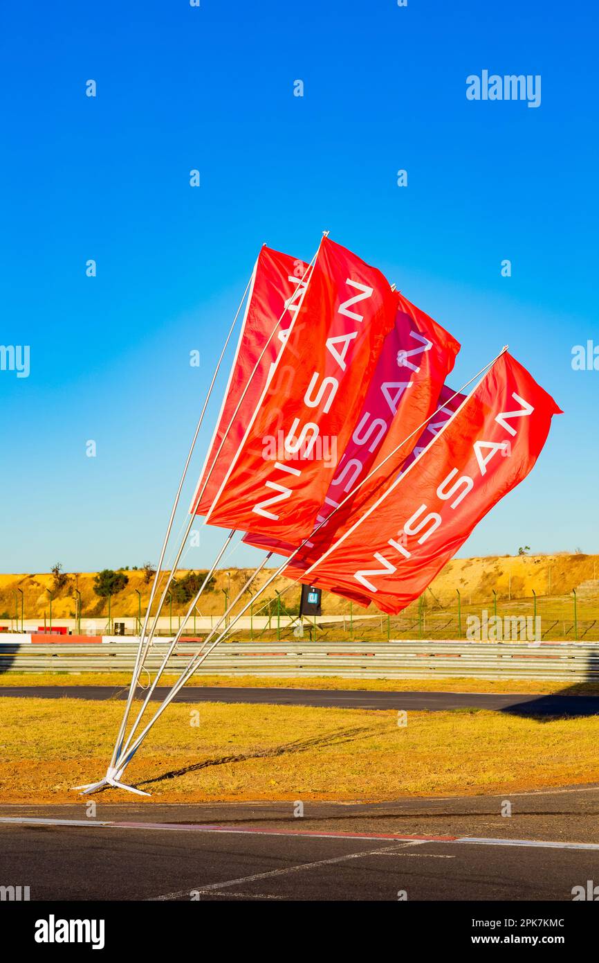 Cape Town, South Africa - February 24, 2023: Nissan vehicle branding flags at race track Stock Photo