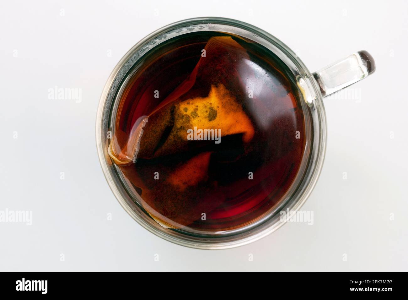 Tea bag in hot water Stock Photo