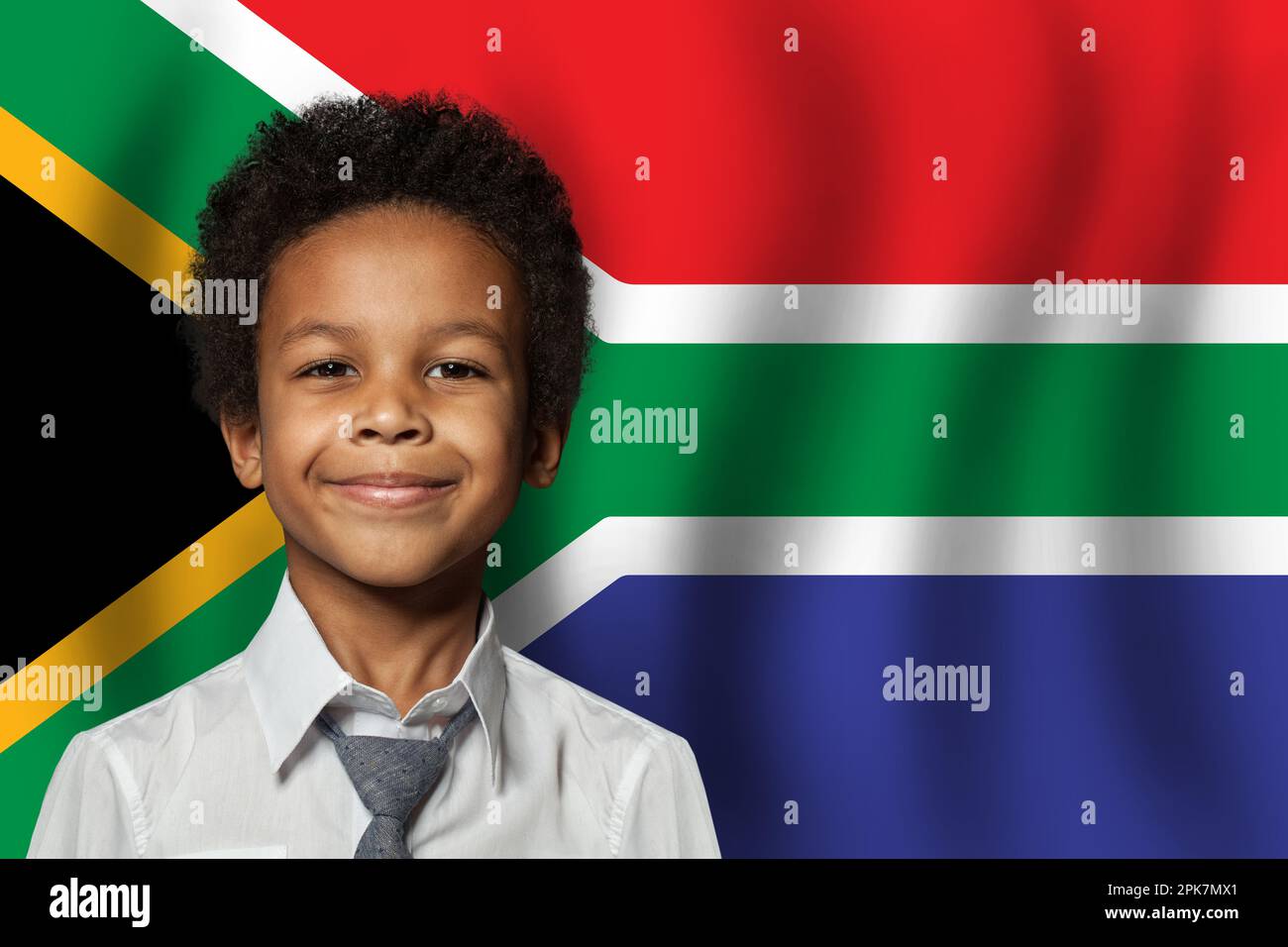 South African kid boy on flag of South Africa background. Education and