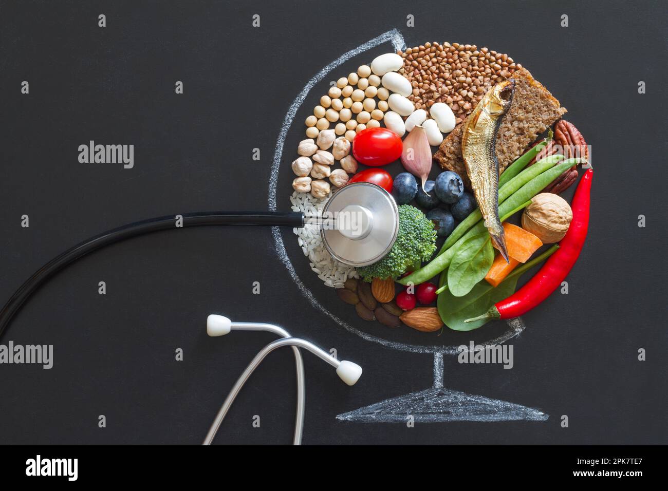 Food products good for health and planet, globe abstraction with stethoscope on chalkboard, planetary health diet concept Stock Photo