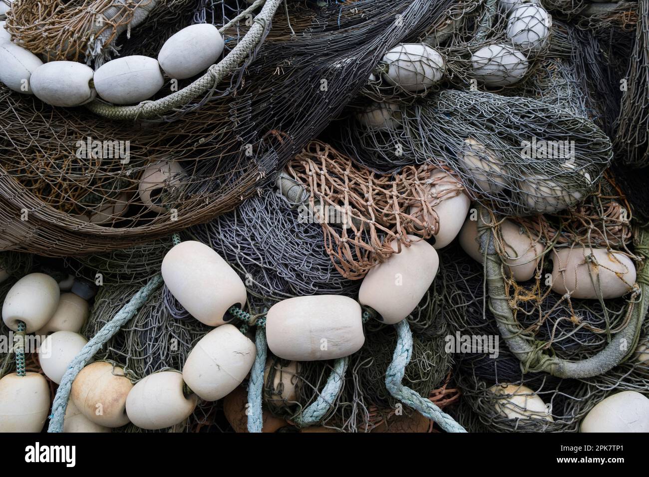 A pile of commercial fishing nets with ropes and floats Stock Photo - Alamy