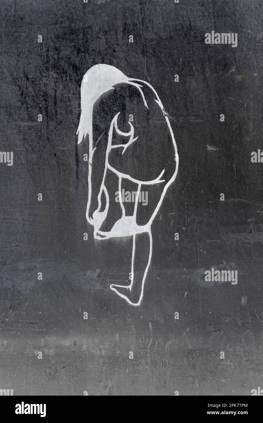 A female nude drawing on a metal wall Stock Photo