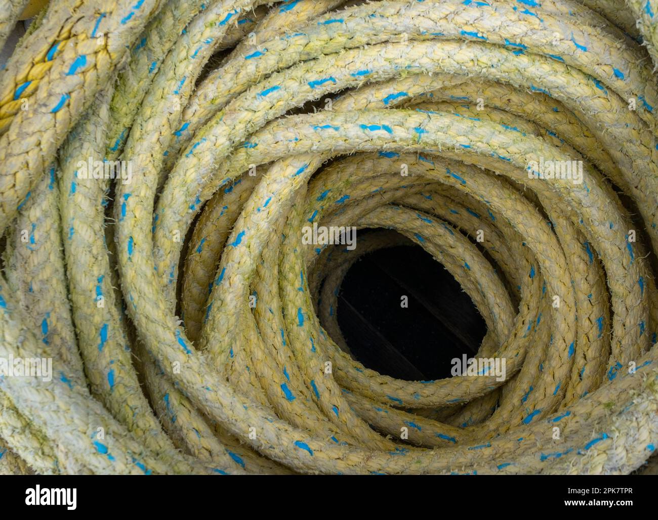 A heap of coiled industrial rope. Stock Photo