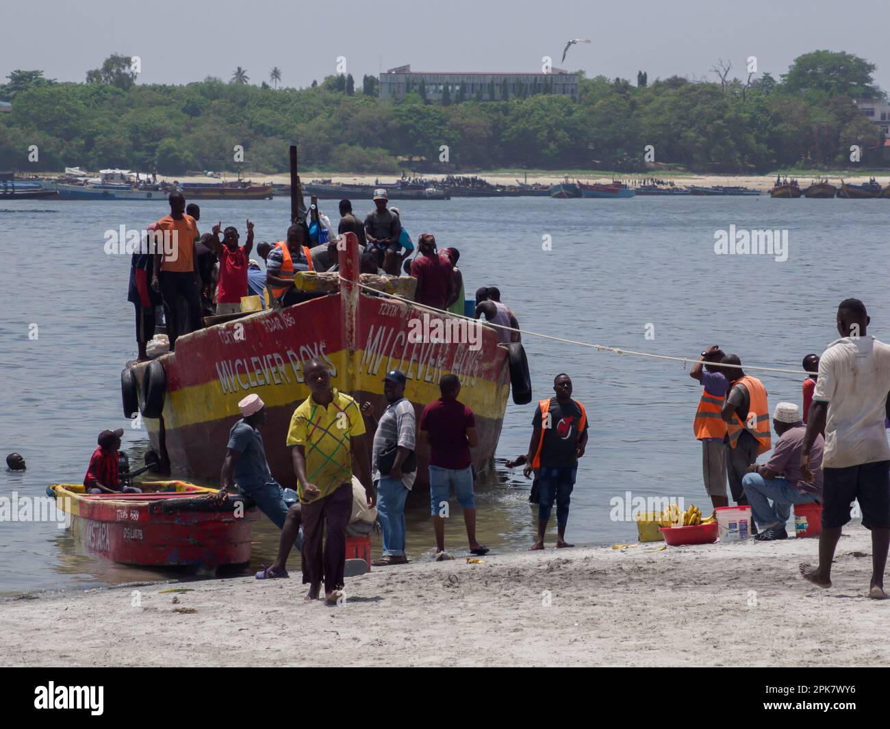 Dar es Salaam, Tanzania - February 2021: A crowd of African fishermen ...