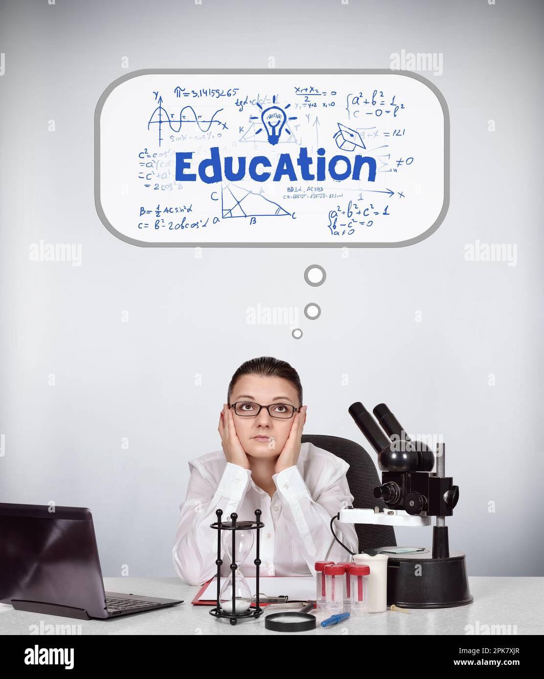 female scientist sitting in laboratory and thinking Stock Photo