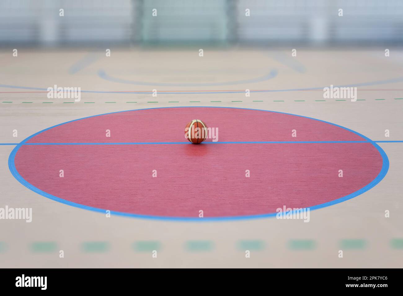 A school sports hall with a marked indoor football pitch, a striped