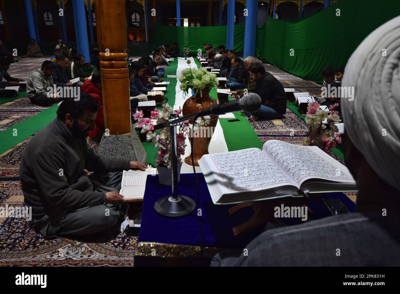 Kashmiri Shia Muslims gather to read the Holy Quran at Historic Imam bargah following Dhuhr