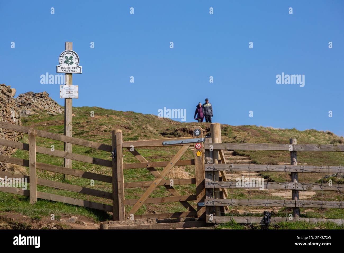 Walkers at the foot of Lose Hill in the English Peak District walking