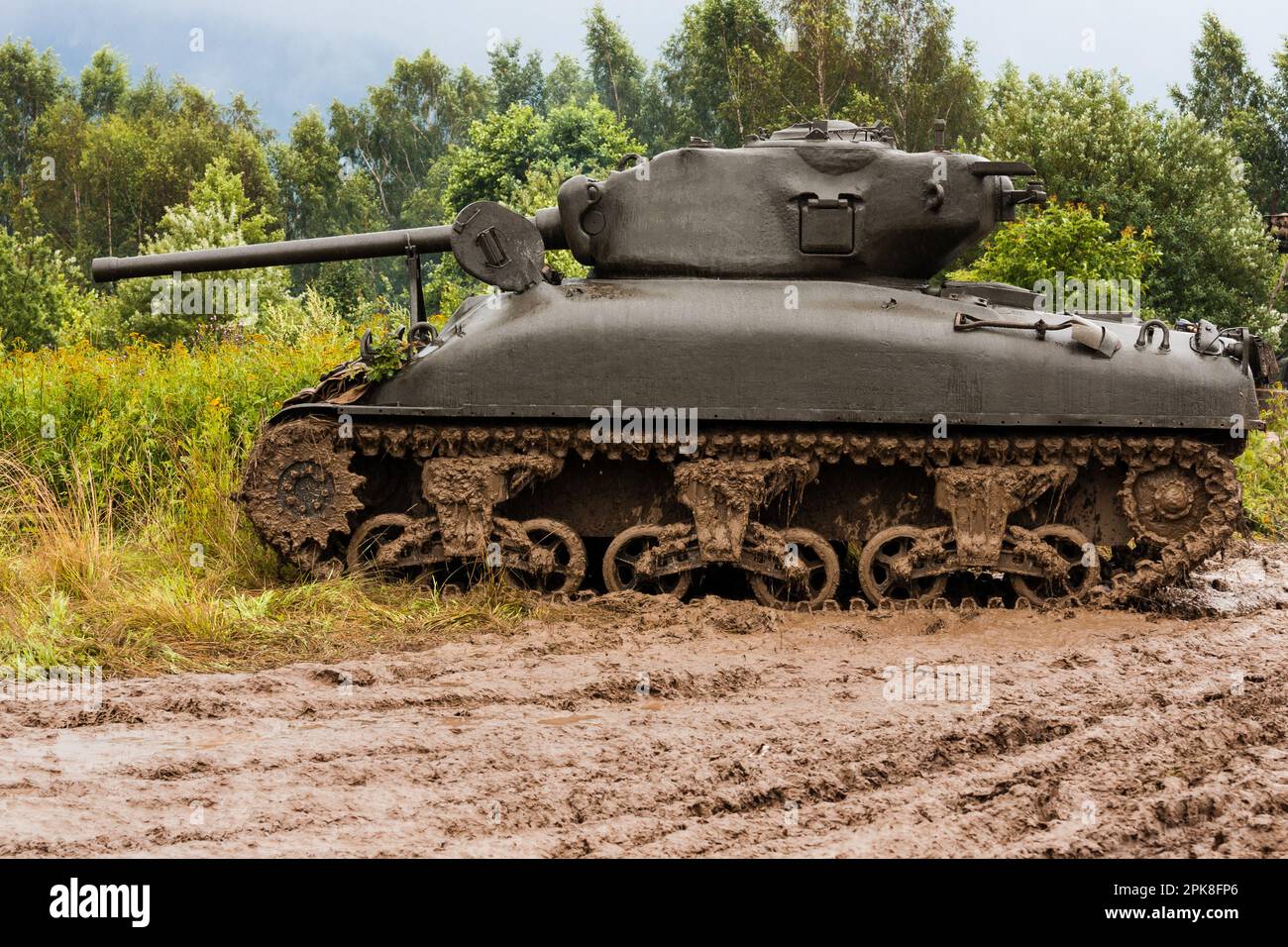 An American World War II Sherman M41A1 76 (w) tank stands in a field in the mud. Bielsko-Biała, Poland Stock Photo