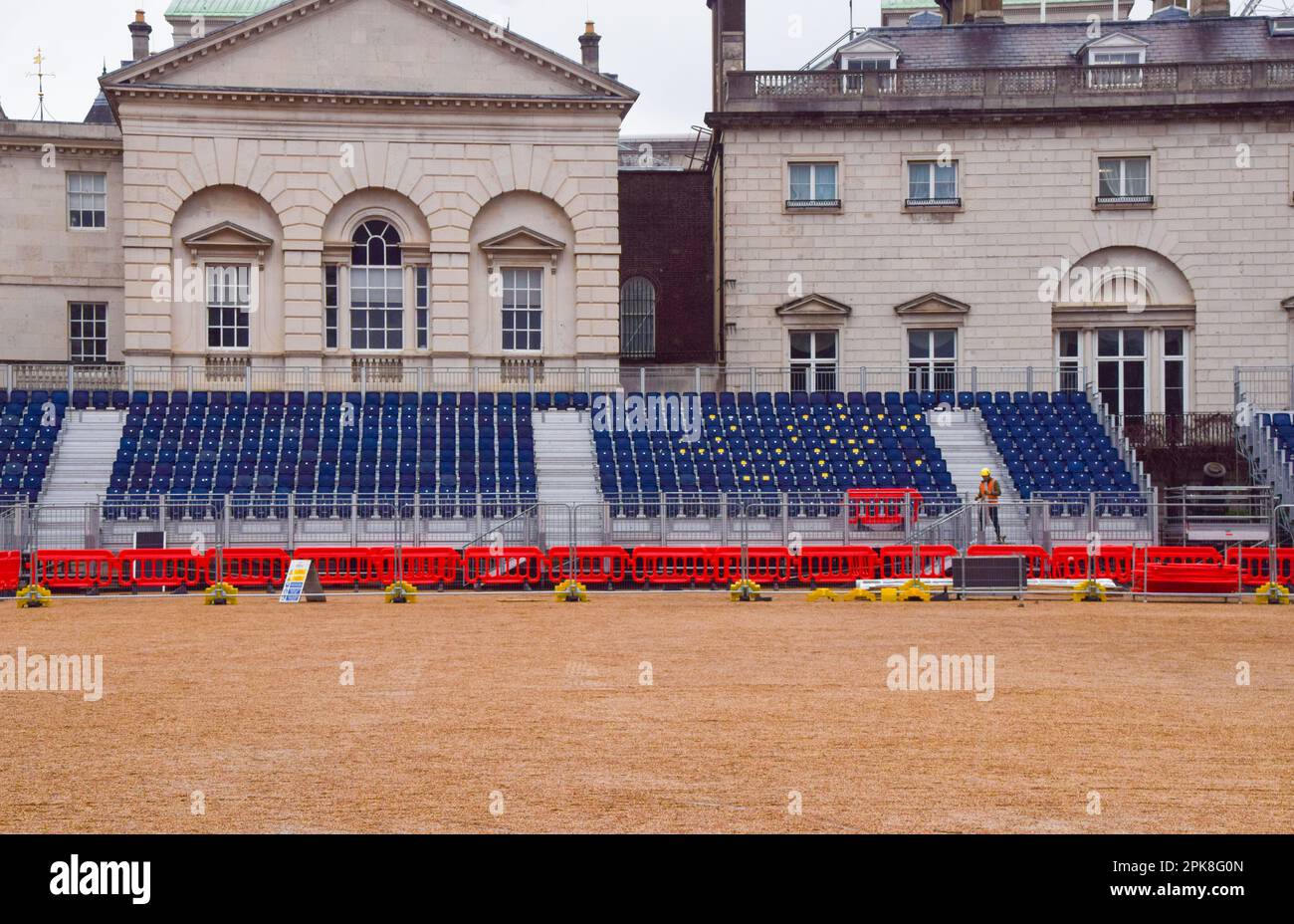 London, UK. 6th April 2023. Workers install seats in Horse Guards Parade as the preparations for