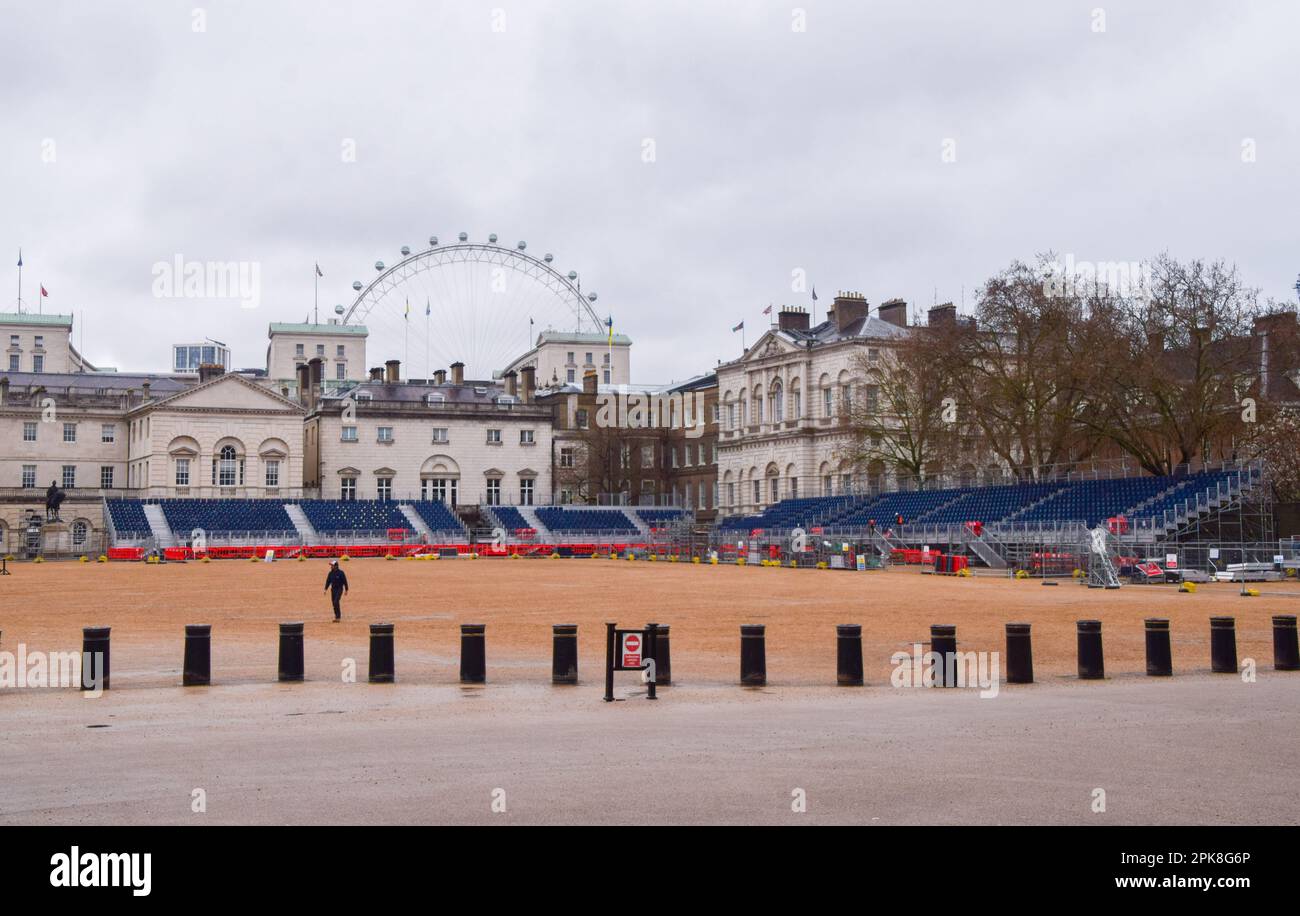London, UK. 6th April 2023. Workers install seats in Horse Guards Parade as the preparations for