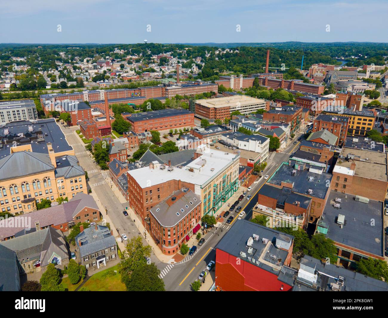Historic commercial buildings on Merrimack Street with Boott Mills at the background in downtown