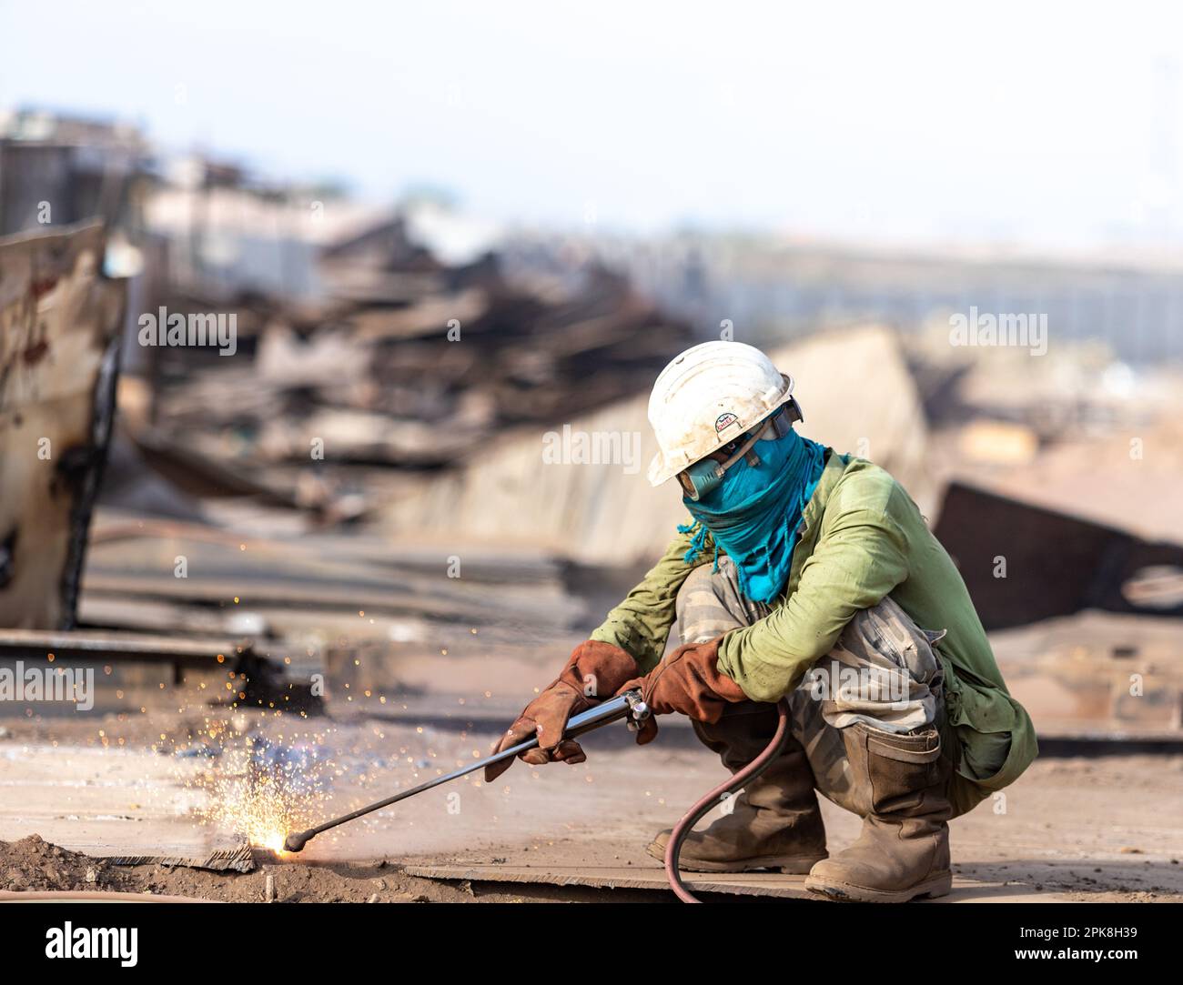 Gadani Pakistan August 2021, a worker wearing yellow safety helmet