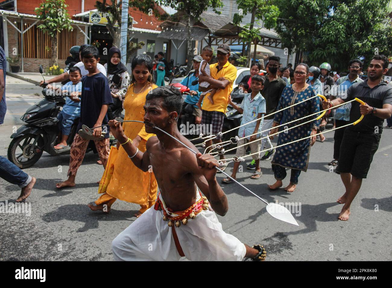 A Hindu man of the Tamil tribe participates in the cheek and body ...