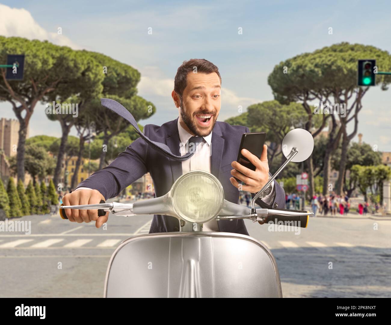 Happy man riding a scooter hi-res stock photography and images - Alamy