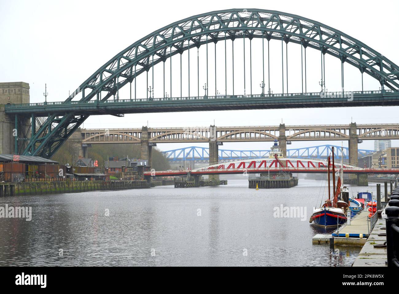 Newcastle upon Tyne, Tyne and Wear, England, UK. Tyne Bridge (1928) over the river, on a grey, rainy day. Stock Photo