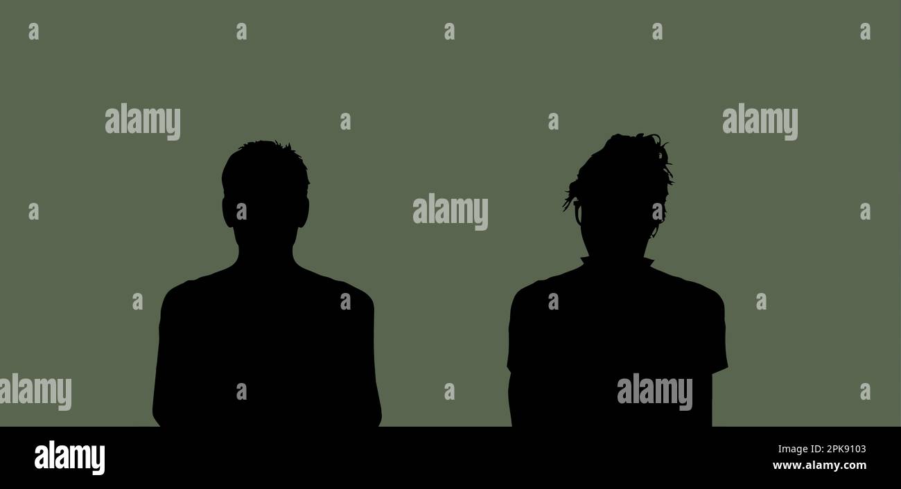 Male and female person silhouette in front of green background Stock Photo