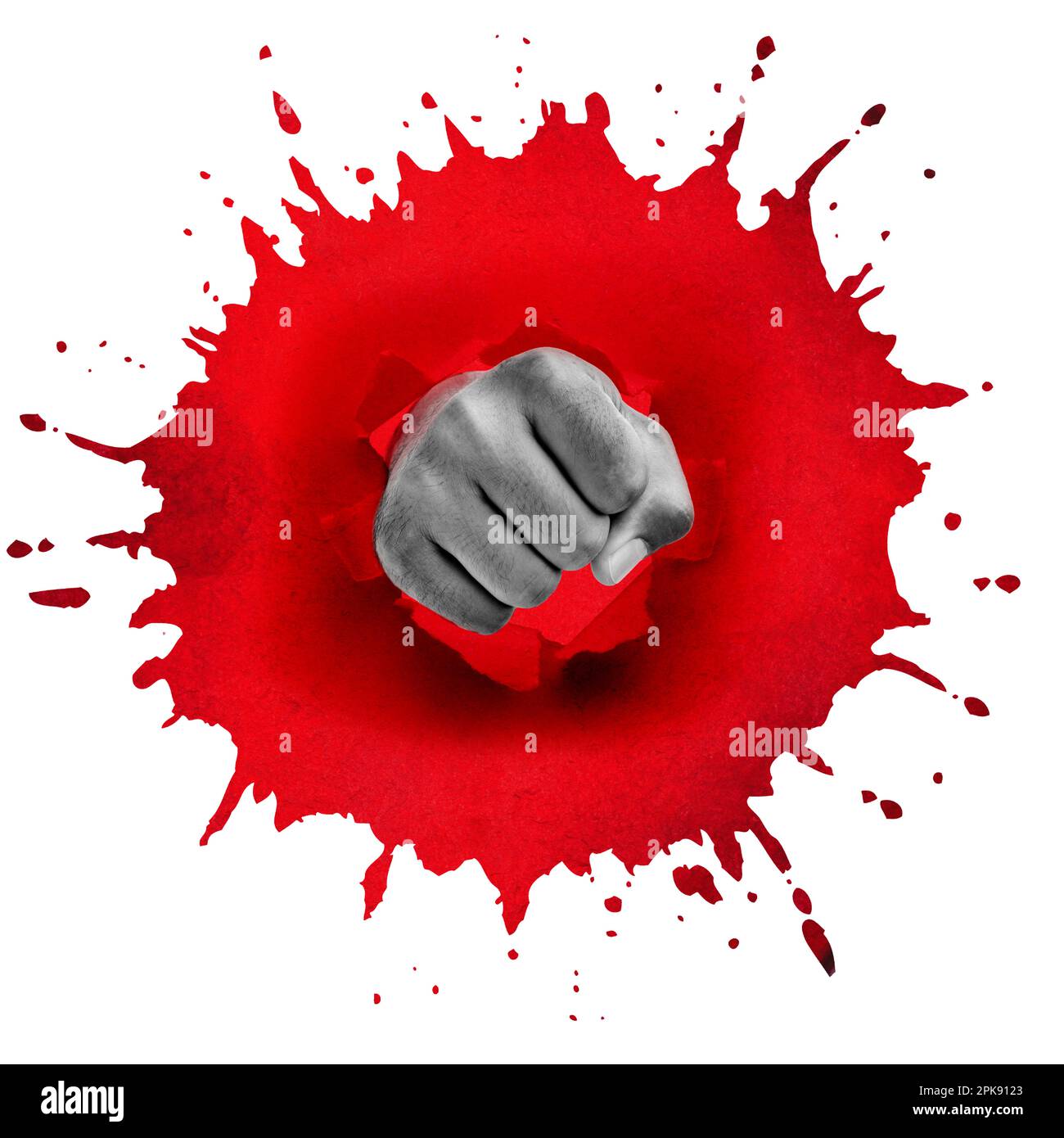 Fist punches through a red spot Stock Photo