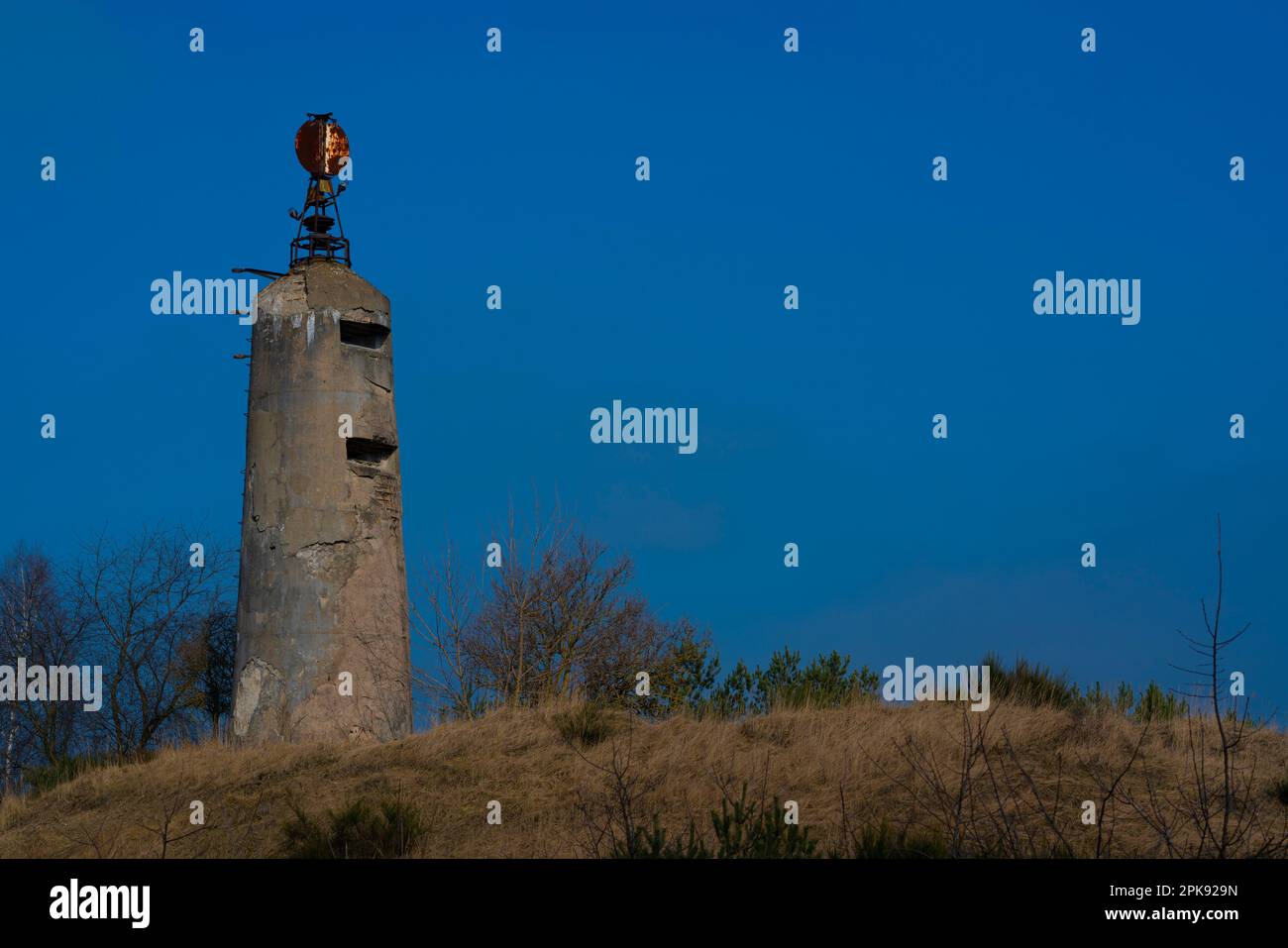 old military tower on a hill in nature Stock Photo