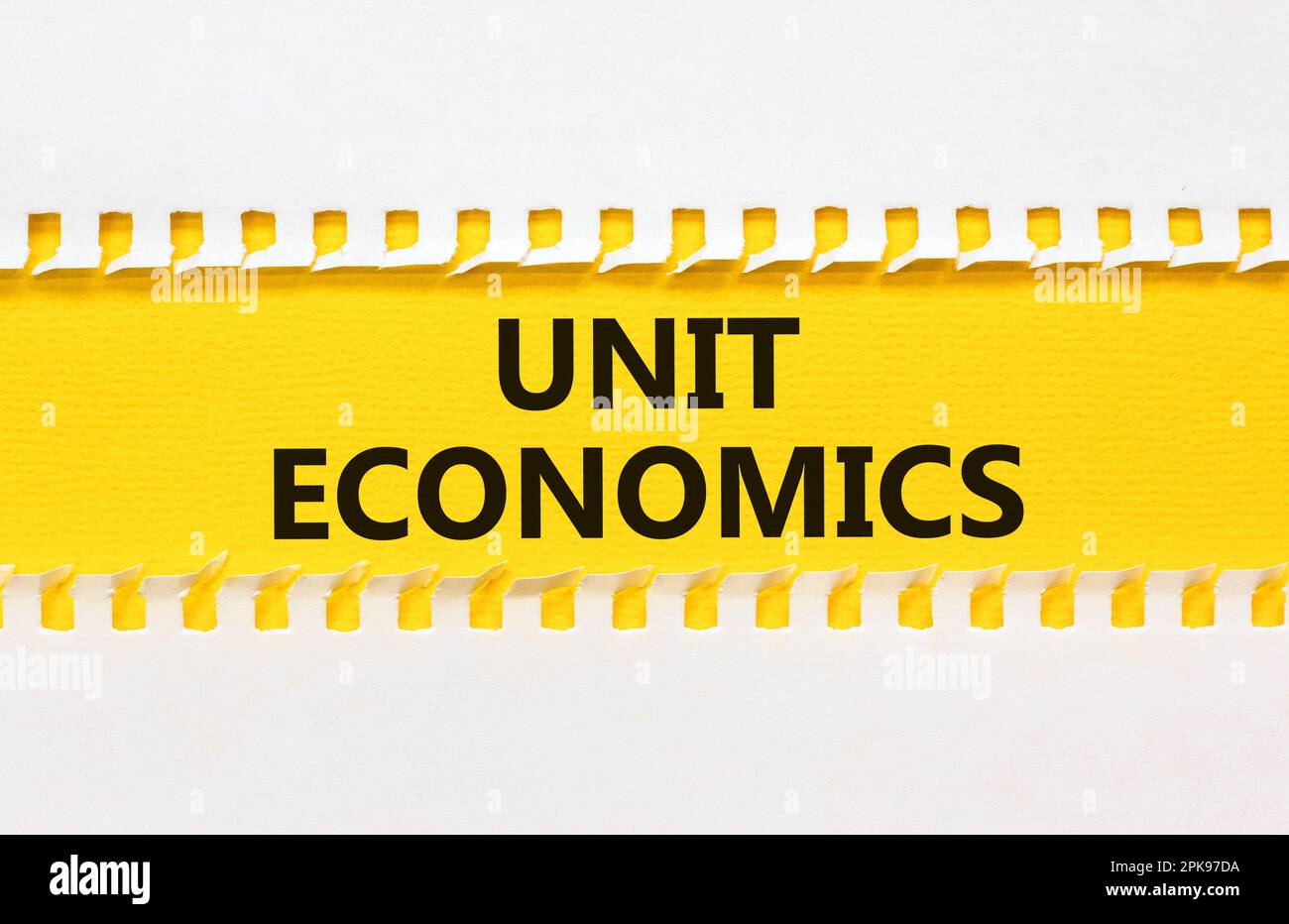 Unit economics symbol. Concept words Unit economics on yellow paper