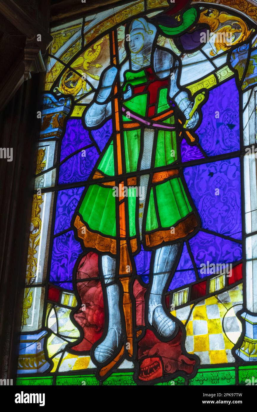 England, Kent, Sevenoaks, Ightham Mote, 14th century Moated Manor House, Stained Glass Window depicting St.George and The Dragon Stock Photo