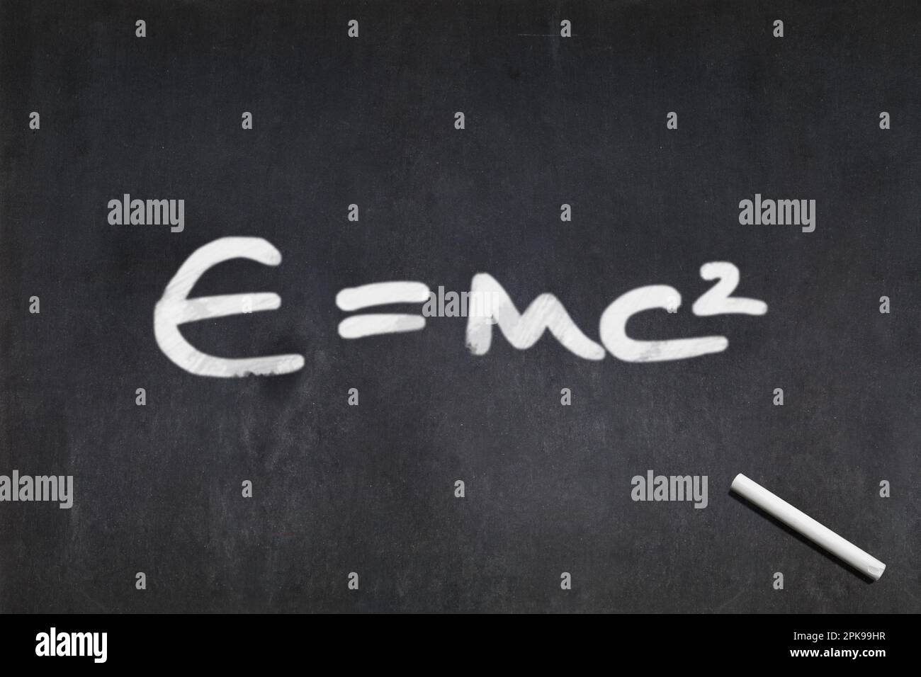 Blackboard with E=mc2, the famous formula by Albert Einstein drawn in