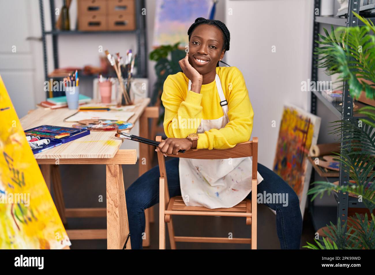 African american woman artist smiling confident at art studio Stock ...