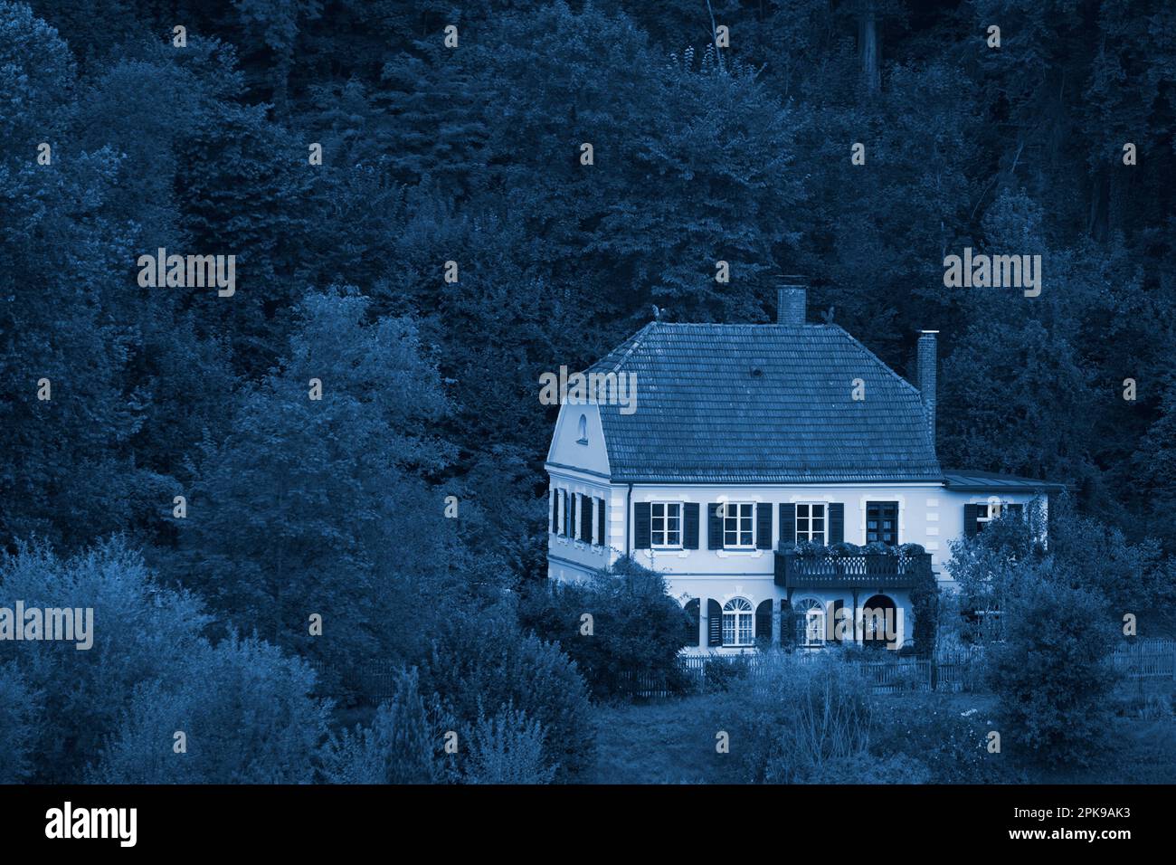 Germany, Bavaria, Upper Bavaria, Altötting district, villa, old building, hipped roof, shutters, single, edge of forest, trees, bushes, evening, twilight, picture colored night blue Stock Photo