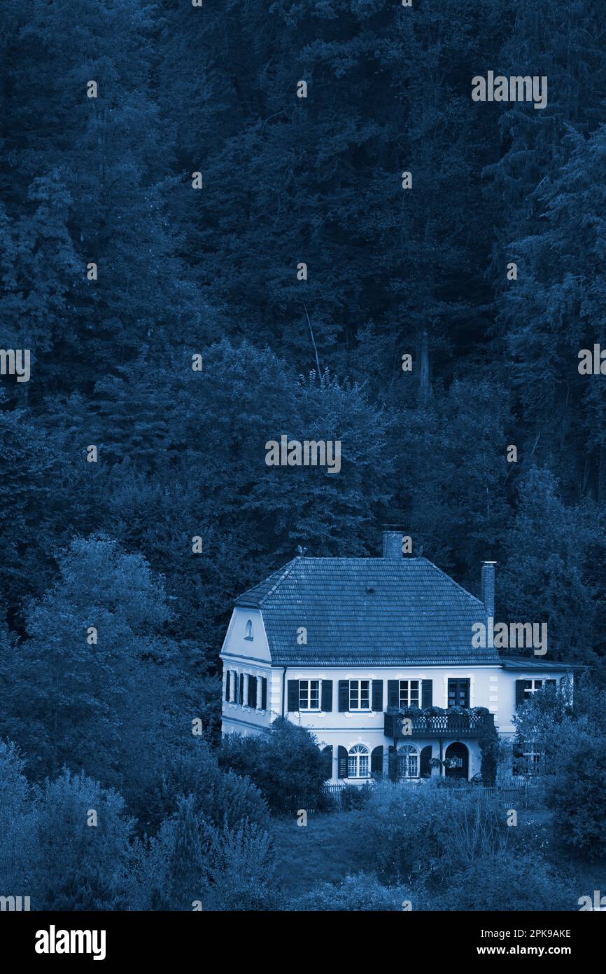 Germany, Bavaria, Upper Bavaria, Altötting district, villa, old building, hipped roof, shutters, single, edge of forest, trees, bushes, evening, twilight, picture colored night blue Stock Photo