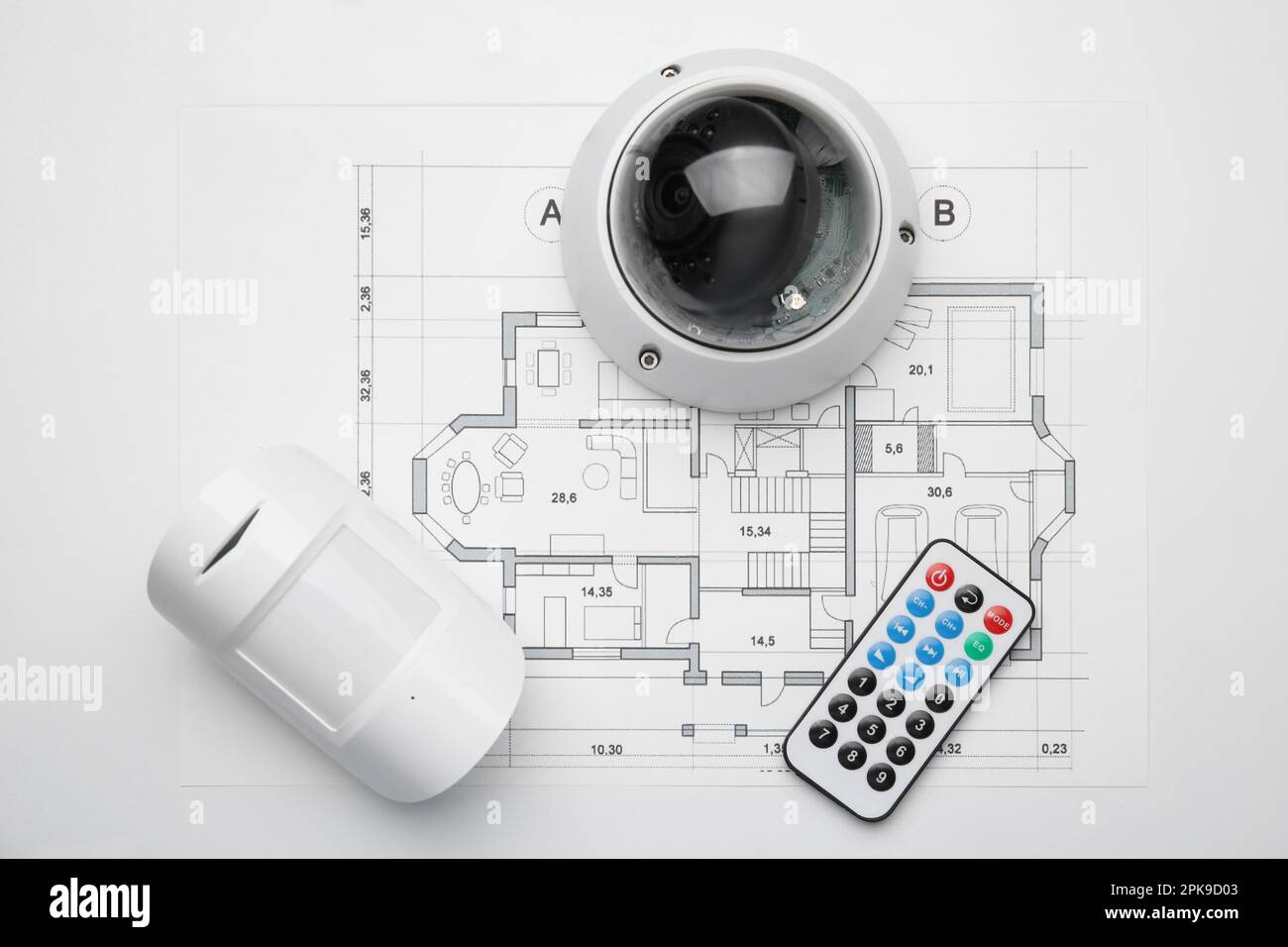 CCTV camera, remote control, movement detector and building plan on ...