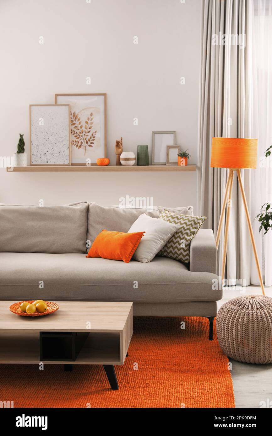 Stylish living room interior with comfortable sofa and coffee table ...