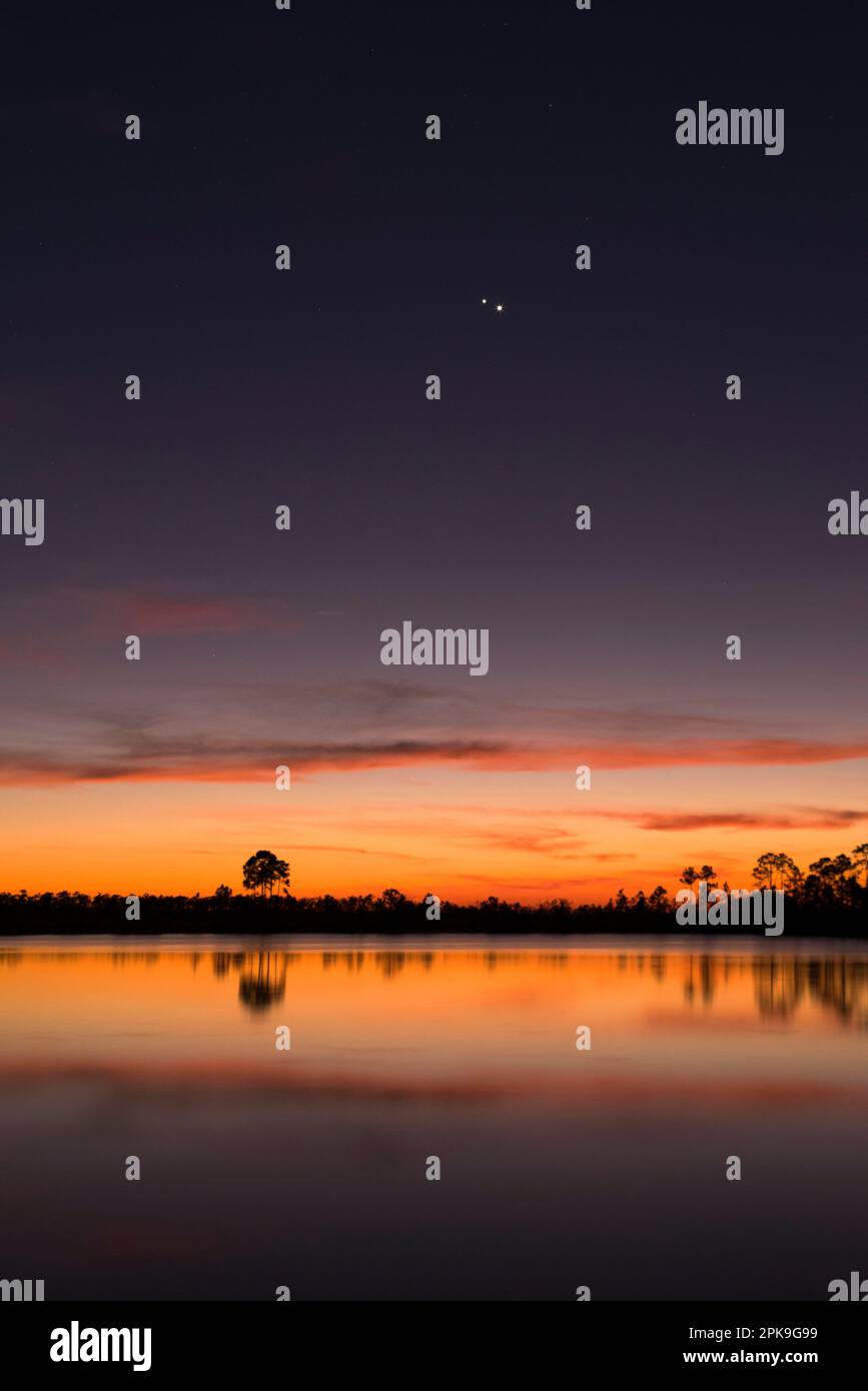 Venus and Jupiter Conjunction, Pine Glades Lake, The Everglades National Park, Florida. USA Stock Photo