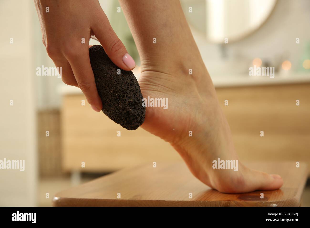 Woman Using Pumice Stone for Removing Dead Skin from Feet in Bathroom,  Closeup Stock Image - Image of hand, abrasive: 241098769